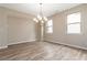Dining area featuring new wood floors, and an elegant chandelier at 4000 Red Canoe Bnd, Lilburn, GA 30047