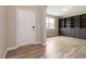Bright entryway featuring hardwood floors, a built-in bookshelf, and a view of a window at 4000 Red Canoe Bnd, Lilburn, GA 30047