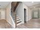 Entryway featuring wood floors and an elegant staircase at 4000 Red Canoe Bnd, Lilburn, GA 30047