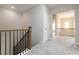 Upstairs hallway with carpet floors at 4000 Red Canoe Bnd, Lilburn, GA 30047