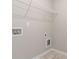 Laundry room with tile floor and utility connections at 4000 Red Canoe Bnd, Lilburn, GA 30047