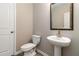 Powder room featuring modern fixtures and a decorative mirror at 4000 Red Canoe Bnd, Lilburn, GA 30047