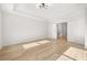 Bedroom featuring light wood floors and a door to an adjacent room at 4400 Ross Estates Ct, Snellville, GA 30039