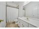 Bright full bathroom with shower/tub combo and white vanity with dual sinks at 84 Nw Gloster Nw Rd, Lawrenceville, GA 30044
