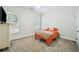 A bright bedroom features neutral walls, carpet, and window with shuttered blinds at 84 Nw Gloster Nw Rd, Lawrenceville, GA 30044