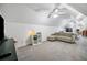 Finished bonus room with multiple ceiling fans, sofa, TV area, and bedroom space at 84 Nw Gloster Nw Rd, Lawrenceville, GA 30044