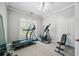 Dedicated exercise room featuring treadmill, elliptical and bench press at 84 Nw Gloster Nw Rd, Lawrenceville, GA 30044