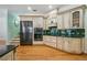 Kitchen with stainless steel appliances, custom cabinets, dark countertops, and tile backsplash at 84 Nw Gloster Nw Rd, Lawrenceville, GA 30044