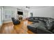 A living room has great natural light, a fireplace, and a large sectional sofa at 84 Nw Gloster Nw Rd, Lawrenceville, GA 30044