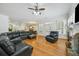 The living room features a fireplace, hardwood floors, and a large sectional sofa at 84 Nw Gloster Nw Rd, Lawrenceville, GA 30044
