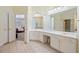 Bright main bathroom with double vanity, tile floors, and separate shower at 84 Nw Gloster Nw Rd, Lawrenceville, GA 30044