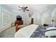 Comfortable main bedroom with king bed, carpet, and access to other rooms at 84 Nw Gloster Nw Rd, Lawrenceville, GA 30044