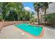 Beautiful in-ground pool with brick trim and lush landscaping providing a private backyard retreat at 84 Nw Gloster Nw Rd, Lawrenceville, GA 30044