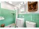 Vintage bathroom featuring original tiling, a retro vanity and a tub-shower combo at 1382 Varner Rd, Marietta, GA 30062