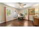 Bright bedroom featuring hardwood floors, two large windows and neutral paint at 1382 Varner Rd, Marietta, GA 30062