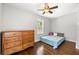 Cozy bedroom featuring neutral colors, a ceiling fan and natural light at 1382 Varner Rd, Marietta, GA 30062