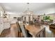 Open floorplan featuring the dining room, kitchen, and fireplace with dark hardwood floors at 1382 Varner Rd, Marietta, GA 30062