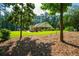 Beautiful home with manicured lawn, mature trees offering serene suburban living, blending natural beauty and cozy architecture at 1382 Varner Rd, Marietta, GA 30062