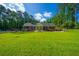 Well-maintained front yard with a classic brick home, lush lawn, and mature trees at 1382 Varner Rd, Marietta, GA 30062