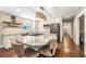 Bright modern kitchen with granite counters and seating at the central island at 1382 Varner Rd, Marietta, GA 30062
