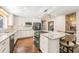 Modern kitchen features granite countertops, stainless steel appliances, and wood floors at 1382 Varner Rd, Marietta, GA 30062