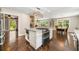 Open kitchen with large island, stainless appliances, and a view of the dining area at 1382 Varner Rd, Marietta, GA 30062