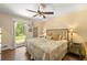 Light-filled main bedroom featuring hardwood floors, windows, and neutral decor at 1382 Varner Rd, Marietta, GA 30062