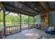 Outdoor porch view with comfortable seating and a serene pond backdrop, creating a relaxing space at 1382 Varner Rd, Marietta, GA 30062