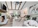 Open-concept living room with modern decor, stone fireplace and hardwood flooring at 1575 Barrier Rd, Marietta, GA 30066