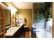 Bathroom featuring a dual vanity, bathtub, and plant decor at 184 Wildflower Dr, Social Circle, GA 30025