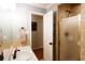 Bathroom featuring tiled shower, updated fixtures, and neutral decor at 184 Wildflower Dr, Social Circle, GA 30025