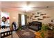 Cozy bedroom with carpeted floor, bed, fan, and vintage decor at 184 Wildflower Dr, Social Circle, GA 30025