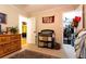 Bedroom showing a changing table and decor, with a peek into closet and bedroom at 184 Wildflower Dr, Social Circle, GA 30025