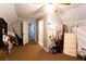 Well-lit bonus room with wall paneling and comfortable carpet flooring at 184 Wildflower Dr, Social Circle, GA 30025
