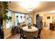 Cozy breakfast nook with bay window and lots of natural light, perfect for morning coffee at 184 Wildflower Dr, Social Circle, GA 30025