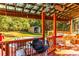 Outdoor deck featuring seating, a view of the pool, and backyard shed at 184 Wildflower Dr, Social Circle, GA 30025
