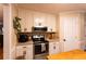 Well-lit kitchen with stainless steel appliances and neutral color palette at 184 Wildflower Dr, Social Circle, GA 30025