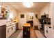 Bright kitchen featuring white cabinetry, stainless steel appliances, and center island at 184 Wildflower Dr, Social Circle, GA 30025