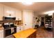 Bright kitchen featuring white cabinetry, stainless steel appliances, and center island at 184 Wildflower Dr, Social Circle, GA 30025