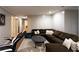 Cozy living room features a large sectional sofa, accent pillows and stylish decor at 184 Wildflower Dr, Social Circle, GA 30025