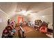 Spacious playroom with vaulted ceilings, ceiling fan, and filled with many fun toys at 184 Wildflower Dr, Social Circle, GA 30025
