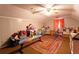 Spacious playroom featuring vaulted ceilings, ceiling fan, and filled with toys at 184 Wildflower Dr, Social Circle, GA 30025