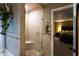 Corner shower with tiled walls, glass doors, and a convenient built-in seat at 184 Wildflower Dr, Social Circle, GA 30025