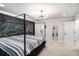 Modern bedroom featuring a canopy bed, statement wall art, and minimalist decor at 76 Mayson Avenue Northeast Ne, Atlanta, GA 30307