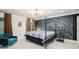 Spacious bedroom featuring a canopy bed, a velvet chair, and large windows with curtains at 76 Mayson Avenue Northeast Ne, Atlanta, GA 30307