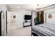 Bright, carpeted bedroom featuring a bed, mounted TV, and modern decor at 76 Mayson Avenue Northeast Ne, Atlanta, GA 30307