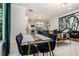 Open floor plan blends dining and living areas; ample sunlight, views to kitchen at 76 Mayson Avenue Northeast Ne, Atlanta, GA 30307