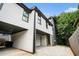 Modern home featuring durable siding, dark window trim, and a convenient carport at 76 Mayson Avenue Northeast Ne, Atlanta, GA 30307