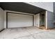 Attached one car garage, sealed concrete driveway, and covered entry to modern house at 76 Mayson Avenue Northeast Ne, Atlanta, GA 30307