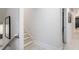 Bright hallway with light wood floors, white walls, and modern black-framed artwork at 76 Mayson Avenue Northeast Ne, Atlanta, GA 30307
